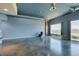 Expansive living room featuring concrete flooring, blue-grey walls, and an open design at 900 Las Vegas Blvd # 1209, Las Vegas, NV 89101