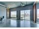 Open-concept living room with polished concrete floors, expansive windows, and a scenic city view at 900 Las Vegas Blvd # 1209, Las Vegas, NV 89101