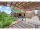 Backyard view showcasing the pergola with a outdoor kitchen and the spacious covered patio with outdoor seating at 903 Billings St, Henderson, NV 89002