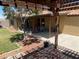 A charming backyard featuring a covered patio, pergola-covered outdoor kitchen, and a lush garden at 903 Billings St, Henderson, NV 89002