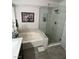 Bright bathroom featuring tub and a tiled shower with glass enclosure and decorative painting at 903 Billings St, Henderson, NV 89002