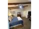 Spacious bedroom with beamed ceilings, large dresser, and access to an en-suite bathroom at 903 Billings St, Henderson, NV 89002