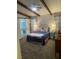 Charming bedroom with exposed beams, decorative lighting and neutral walls, offering a cozy retreat at 903 Billings St, Henderson, NV 89002