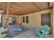 Covered patio featuring outdoor seating, providing a relaxing space for entertaining or enjoying the backyard at 903 Billings St, Henderson, NV 89002