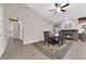 Elegant dining room with a fireplace, a round wood table and seating for six at 903 Billings St, Henderson, NV 89002