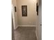 Neutral hallway with ceramic tile flooring, leading to bedrooms and bathrooms at 903 Billings St, Henderson, NV 89002