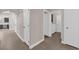 Hallway view showcasing the tile flooring and the laundry area offering a functional and stylish transition between spaces at 903 Billings St, Henderson, NV 89002
