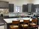 Well-lit kitchen with stainless steel appliances, a central island, and modern fixtures at 903 Billings St, Henderson, NV 89002