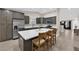 Modern kitchen with stainless steel appliances, center island, and stylish gray cabinetry at 903 Billings St, Henderson, NV 89002