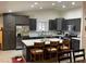 Bright, modern kitchen with stainless steel appliances, island seating, and ample cabinet space at 903 Billings St, Henderson, NV 89002
