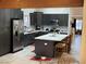 Modern kitchen featuring gray cabinets, stainless steel appliances, and a spacious island at 903 Billings St, Henderson, NV 89002