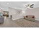 Inviting living room showcasing tile flooring, neutral paint, and a ceiling fan at 903 Billings St, Henderson, NV 89002