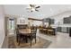 An open plan kitchen and dining area adjacent to the living room featuring tile floors at 903 Billings St, Henderson, NV 89002