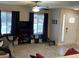 Cozy living room featuring tile floors, a ceiling fan, and lots of natural light at 903 Billings St, Henderson, NV 89002