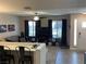 Bright living room with lots of natural light, a ceiling fan, and an open floorplan at 903 Billings St, Henderson, NV 89002