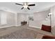 Spacious living room offering tile floors, neutral paint, and a modern ceiling fan at 903 Billings St, Henderson, NV 89002