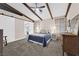Cozy bedroom with carpet flooring, wood beam ceiling, and ample natural light at 903 Billings St, Henderson, NV 89002