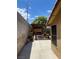 View of the side yard featuring a shaded pergola with outdoor kitchen, ready for entertaining at 903 Billings St, Henderson, NV 89002