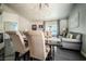 Staged dining room featuring a modern chandelier, seating for six, and gray accent wall with artwork at 906 Sitting Bull Dr, Henderson, NV 89014
