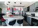 Stylish kitchen features a breakfast bar, pendant lighting, and gray cabinetry at 906 Sitting Bull Dr, Henderson, NV 89014