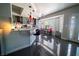 Modern kitchen with stainless steel appliances, gray cabinetry, breakfast bar and adjacent breakfast nook at 906 Sitting Bull Dr, Henderson, NV 89014