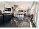 Open-concept living area showcasing a large TV, stylish island, and easy access to the dining area at 906 Sitting Bull Dr, Henderson, NV 89014