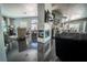 Spacious living area with a fireplace, TV, and view into kitchen, dining, and sitting areas at 906 Sitting Bull Dr, Henderson, NV 89014