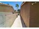 Long cement pathway extending along the side of the house with block wall at 906 Sitting Bull Dr, Henderson, NV 89014