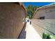 Cement pathway along the side of the house with block wall leading to the backyard at 906 Sitting Bull Dr, Henderson, NV 89014
