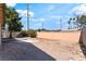 Spacious backyard featuring a high block wall for added privacy and mature trees offering shade at 908 N 24Th St, Las Vegas, NV 89101
