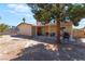 Expansive backyard with mature trees providing shade and privacy at 908 N 24Th St, Las Vegas, NV 89101