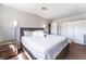 A bedroom features a large bed with soft lighting and a closet at 908 N 24Th St, Las Vegas, NV 89101