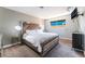 This bedroom features a plush bed, a window view, and neutral décor at 908 N 24Th St, Las Vegas, NV 89101