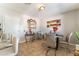 Cozy dining room with a stylish glass table and four neutral chairs at 908 N 24Th St, Las Vegas, NV 89101