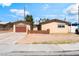 Charming single-story home with a well-maintained front yard and attached garage at 908 N 24Th St, Las Vegas, NV 89101