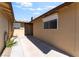 Side view of the home's exterior with security screen at 908 N 24Th St, Las Vegas, NV 89101
