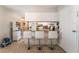 Eat-in kitchen with marble countertop and three bar stools at 908 N 24Th St, Las Vegas, NV 89101