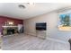 Open living room with stone fireplace and view of the backyard at 908 N 24Th St, Las Vegas, NV 89101