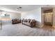 Spacious living room with wood-look tile flooring and light gray paint at 908 N 24Th St, Las Vegas, NV 89101