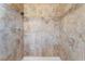 Close-up of a tile shower with neutral-toned tiles and a shower head at 908 N 24Th St, Las Vegas, NV 89101