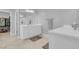 Bright bathroom featuring double sinks and access to a walk-in closet at 9643 Wildflower Vista Ave, Las Vegas, NV 89166