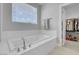 Bathroom showcasing large tub and separate closet at 9643 Wildflower Vista Ave, Las Vegas, NV 89166