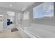 Bathroom with a glass shower and a soaking tub at 9643 Wildflower Vista Ave, Las Vegas, NV 89166