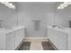 Bathroom featuring double sinks and tiled floor at 9643 Wildflower Vista Ave, Las Vegas, NV 89166