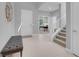 Inviting foyer with light wood floors, a staircase, and access to a home office at 9643 Wildflower Vista Ave, Las Vegas, NV 89166