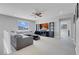 Open loft area with neutral colors and a large sectional sofa at 9643 Wildflower Vista Ave, Las Vegas, NV 89166