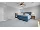 Spacious bedroom with recessed lighting, large windows, and a comfortable upholstered bed at 9643 Wildflower Vista Ave, Las Vegas, NV 89166