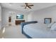 Spacious primary bedroom with comfortable king bed and ensuite bathroom with a walk-in closet at 9643 Wildflower Vista Ave, Las Vegas, NV 89166