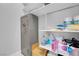 Organized walk-in pantry with shelving, cleaning supplies, and storage for household items at 9643 Wildflower Vista Ave, Las Vegas, NV 89166