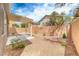The backyard has a covered patio and low-maintenance desert landscaping at 9766 Marcelline Ave, Las Vegas, NV 89148